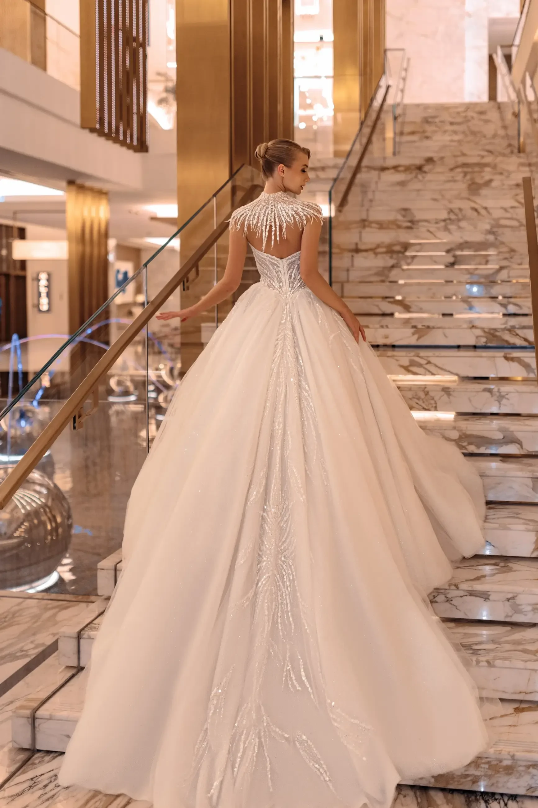model is wearing a ball gown wedding dress by giovanna alessandra