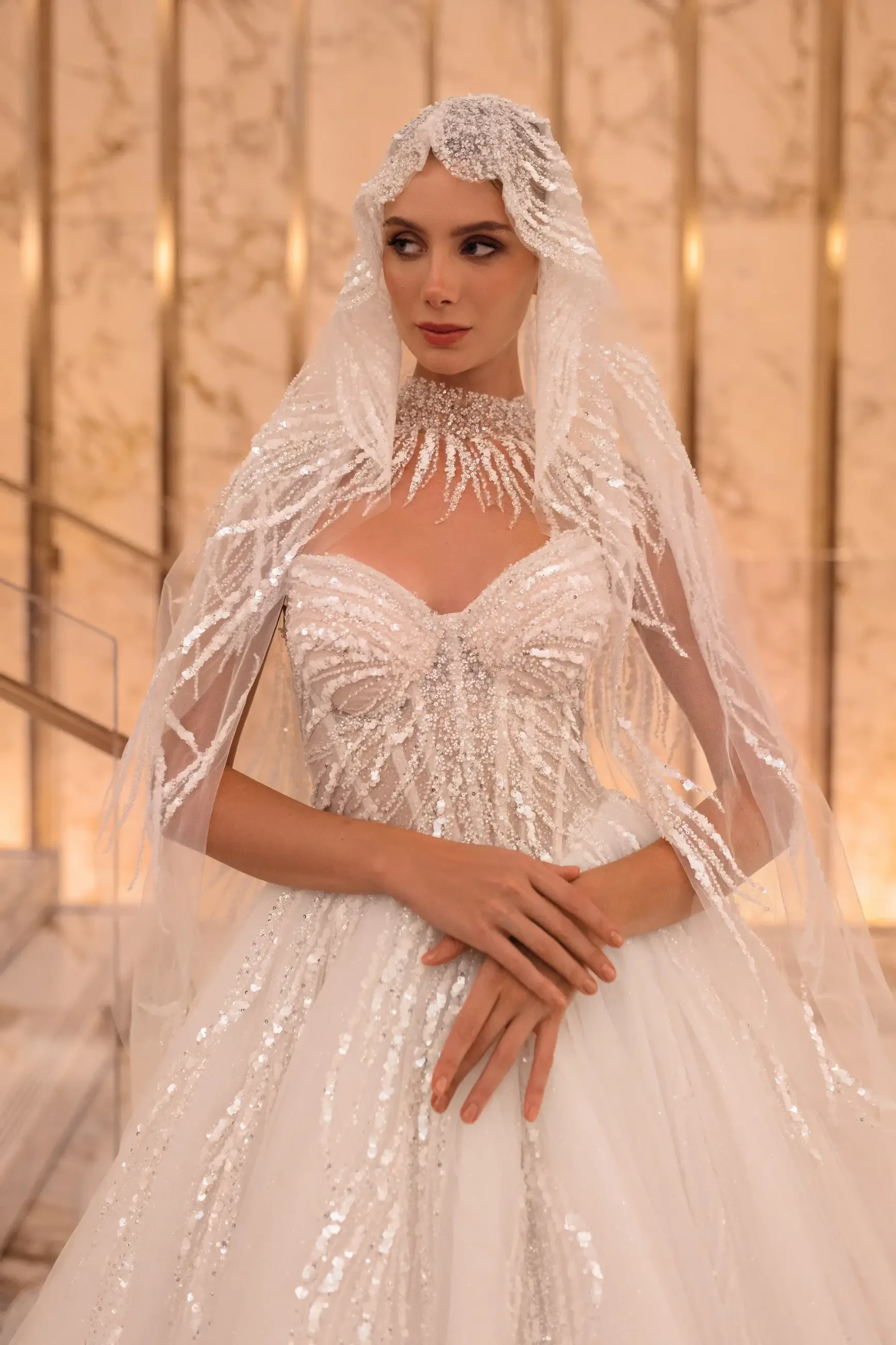 model is wearing a ball gown wedding dress by giovanna alessandra