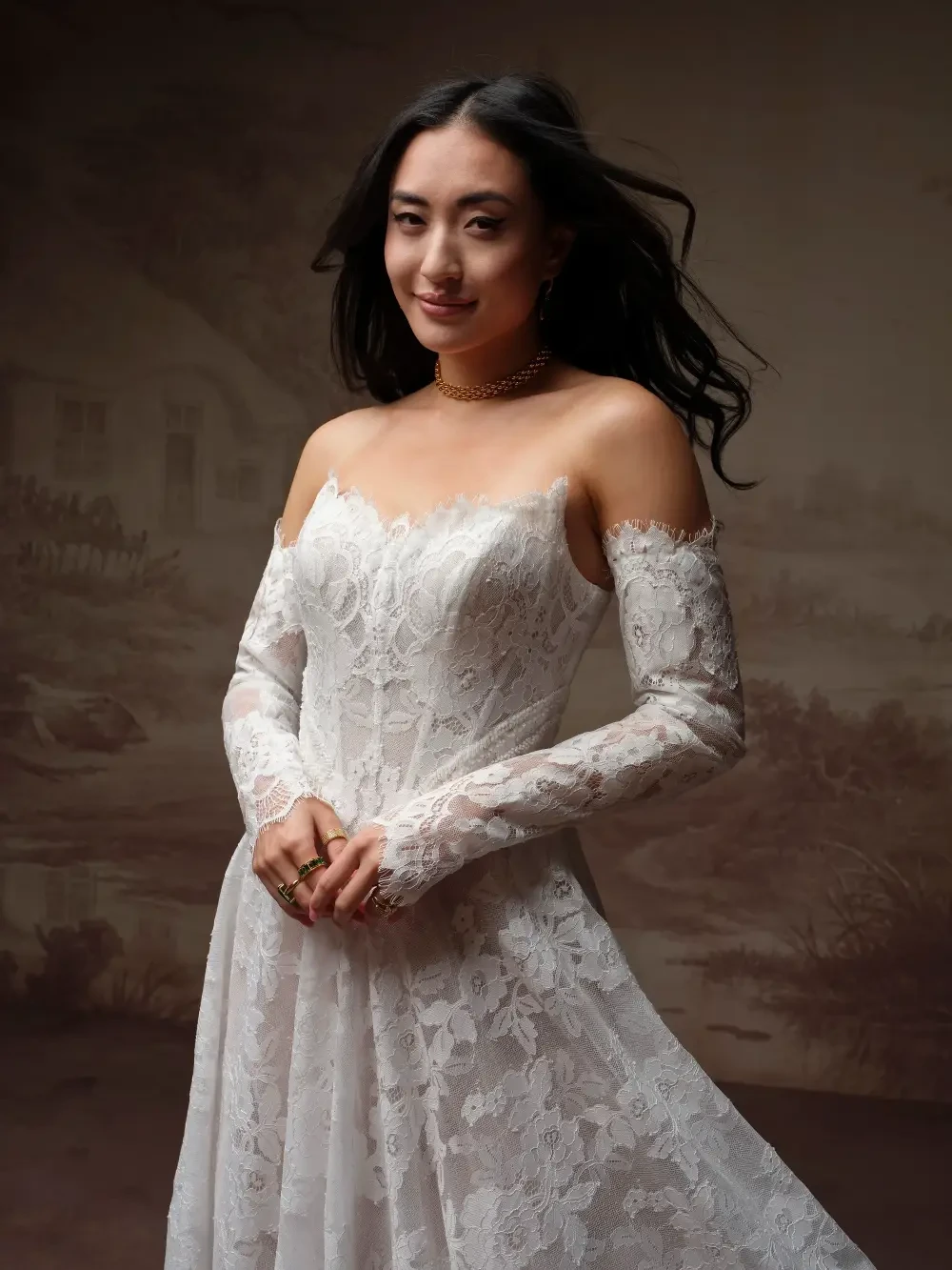 model is wearing a cat eye neckline bridal gown