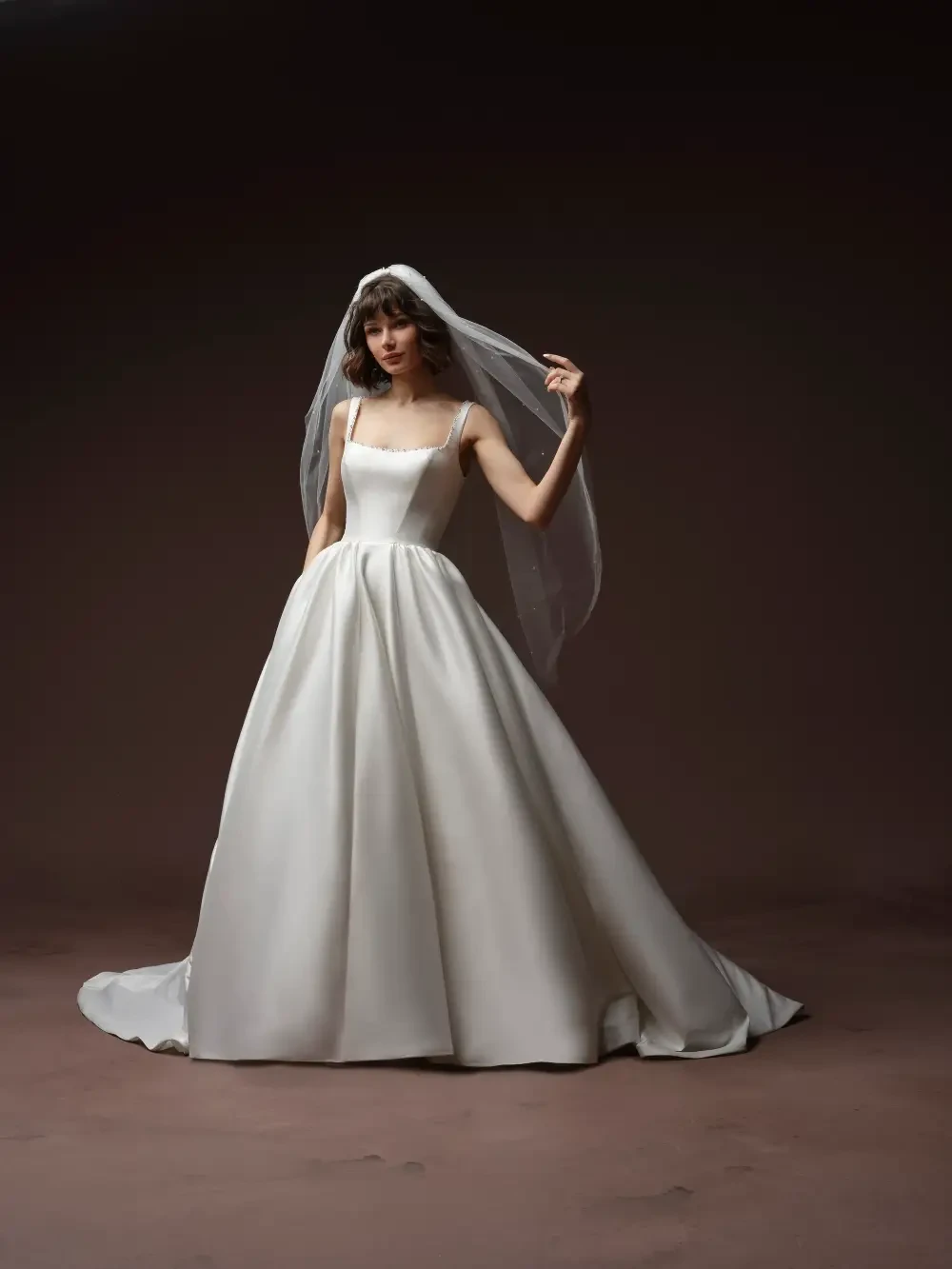 model is wearing a bold ball gown