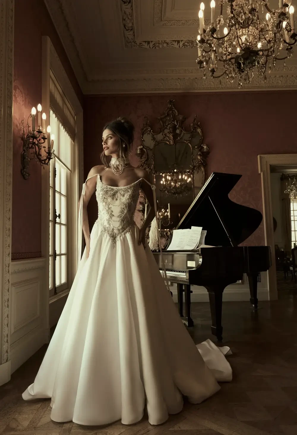 model is wearing a strapless drop waist bridal gown